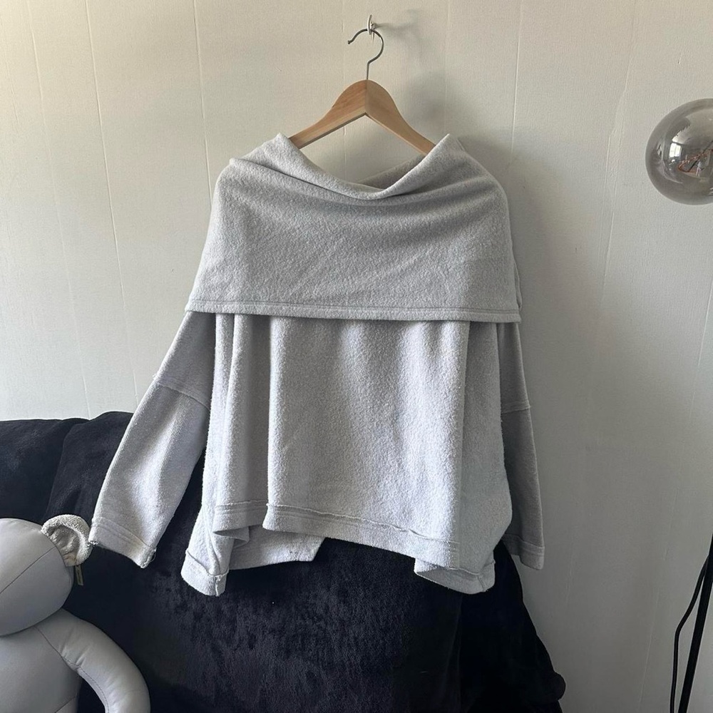 Oversized grey open back sweater with a relaxed, boho vibe